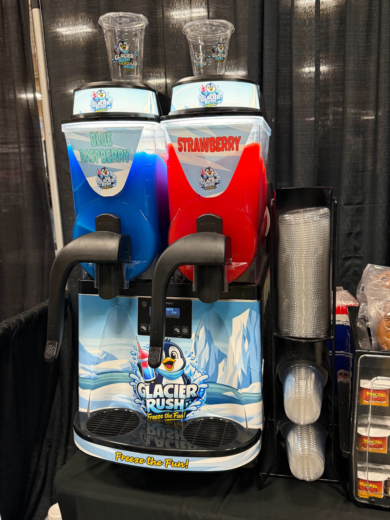 Glacier Rush two-barrel frozen drink machine with cup dispenser